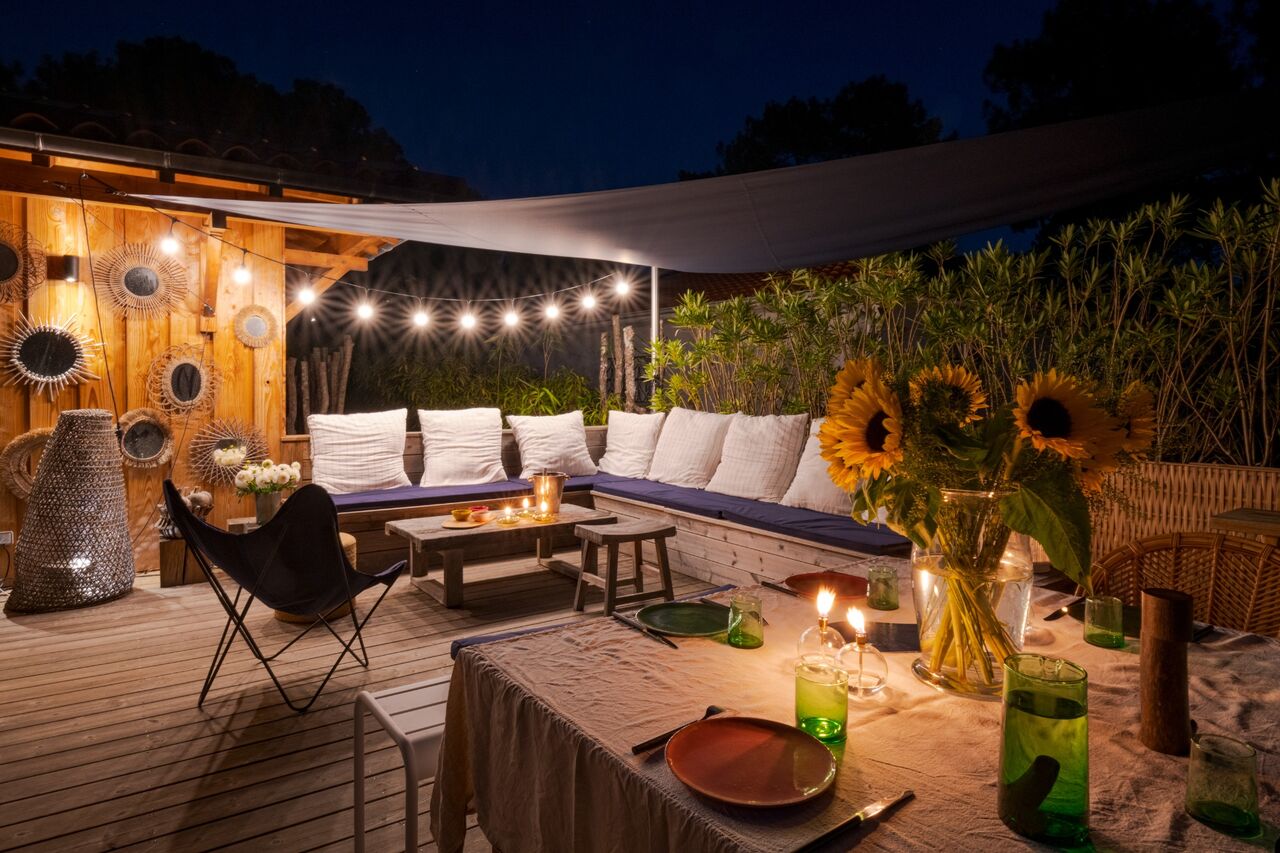Terrace and pool lit at night